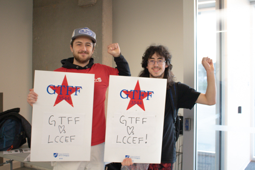 GTFF union members posing with signs that read "GTFF loves LCCEF!"